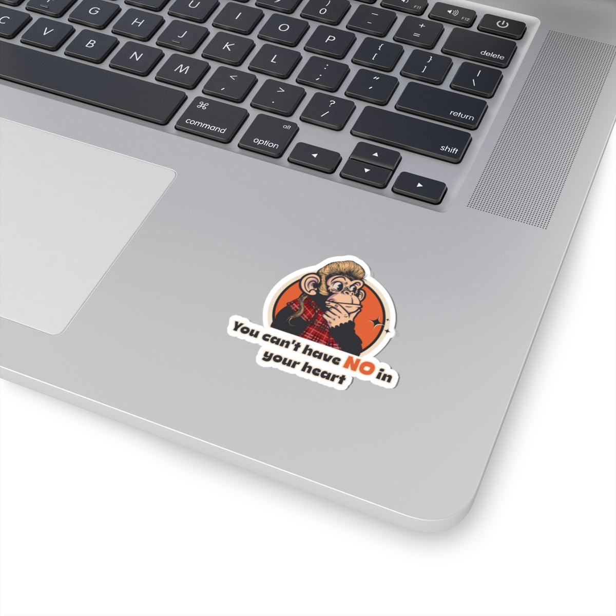 “You Can’t Have No in Your Heart” Throwback Jack Sticker Inspired by Joe Dirt Laptop with a sticker featuring a monkey and text on the palm rest area.